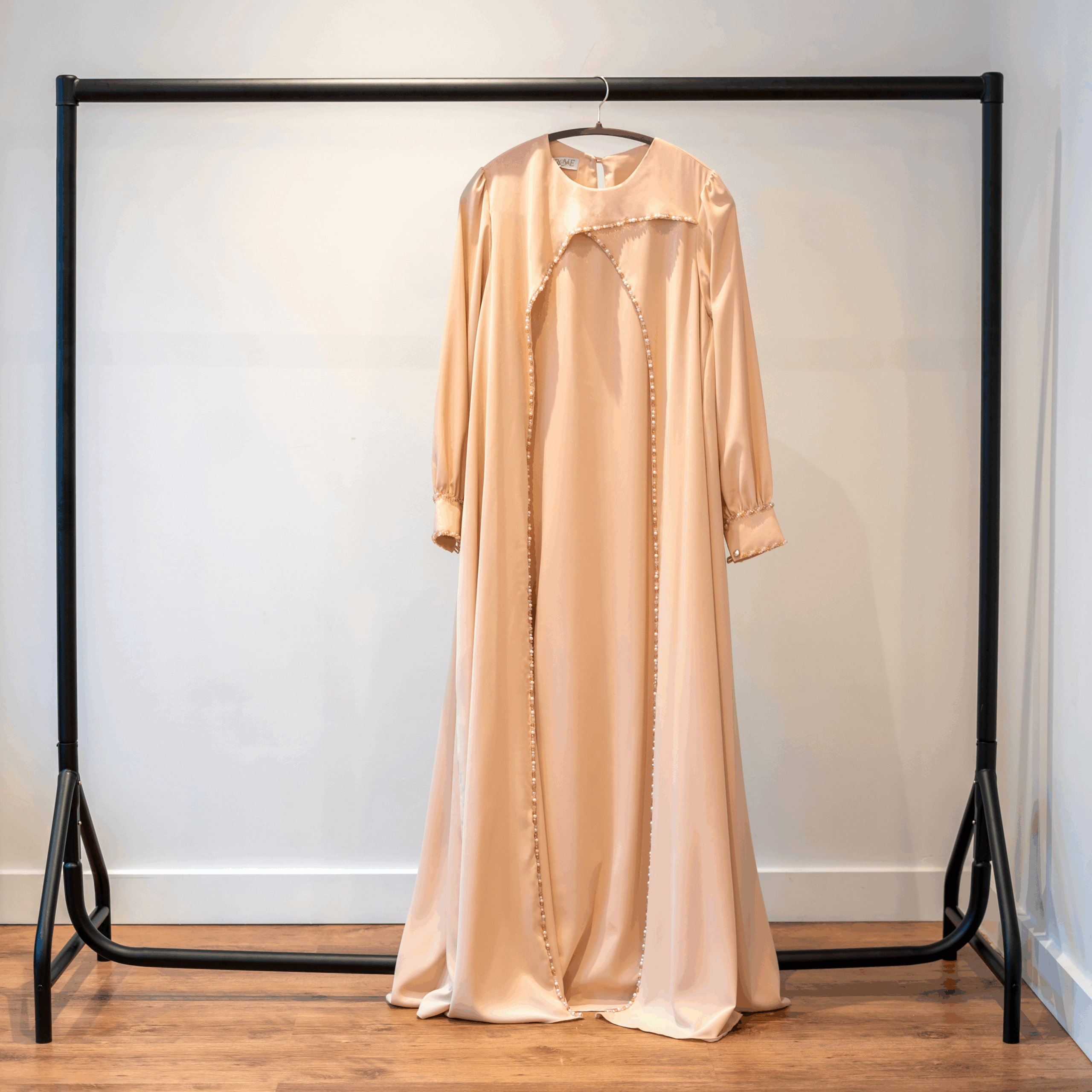 Waterfall beige abaya – full front view on hanger
