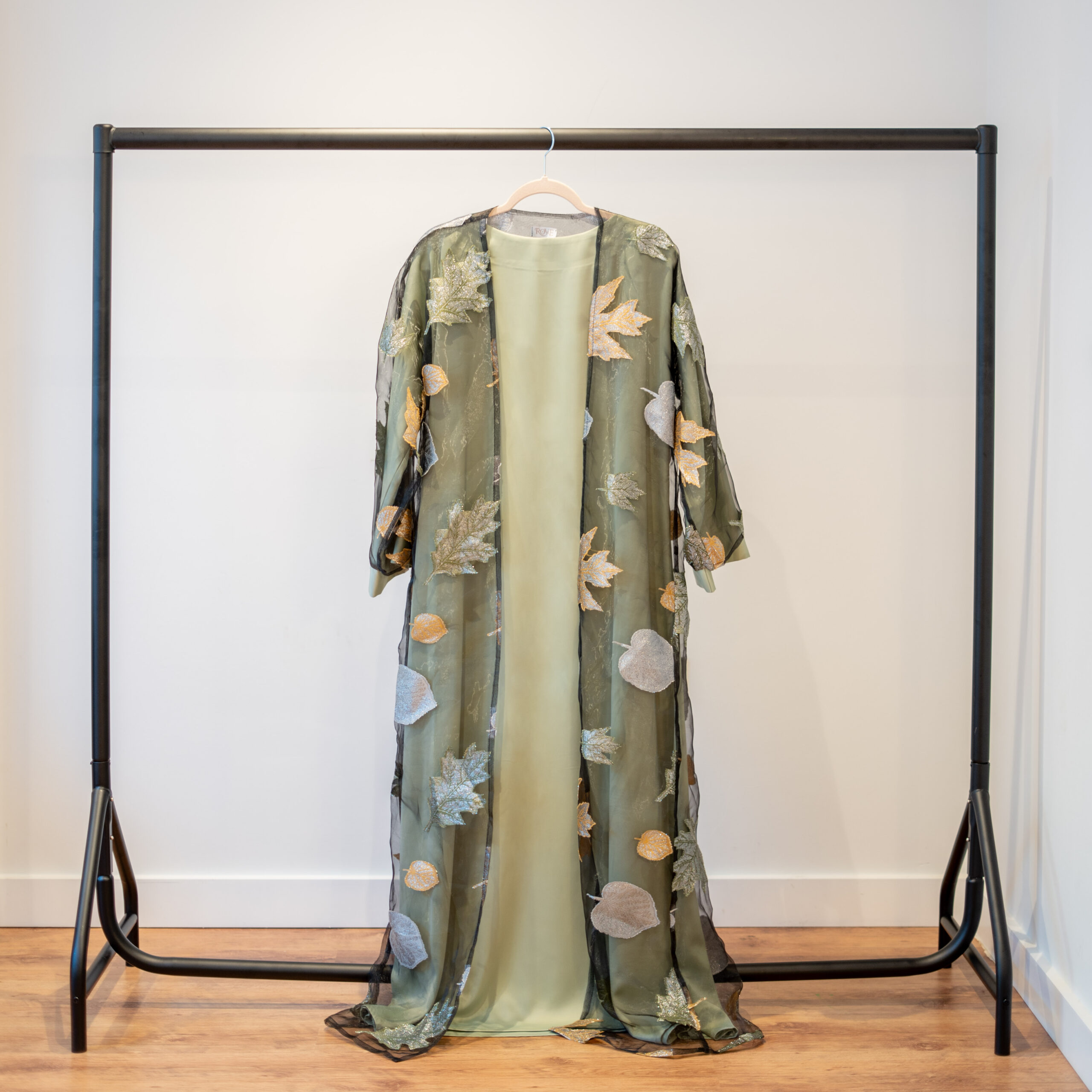 Autumn Bloom abaya in Pistachio Green – full length abaya with patterned overlay