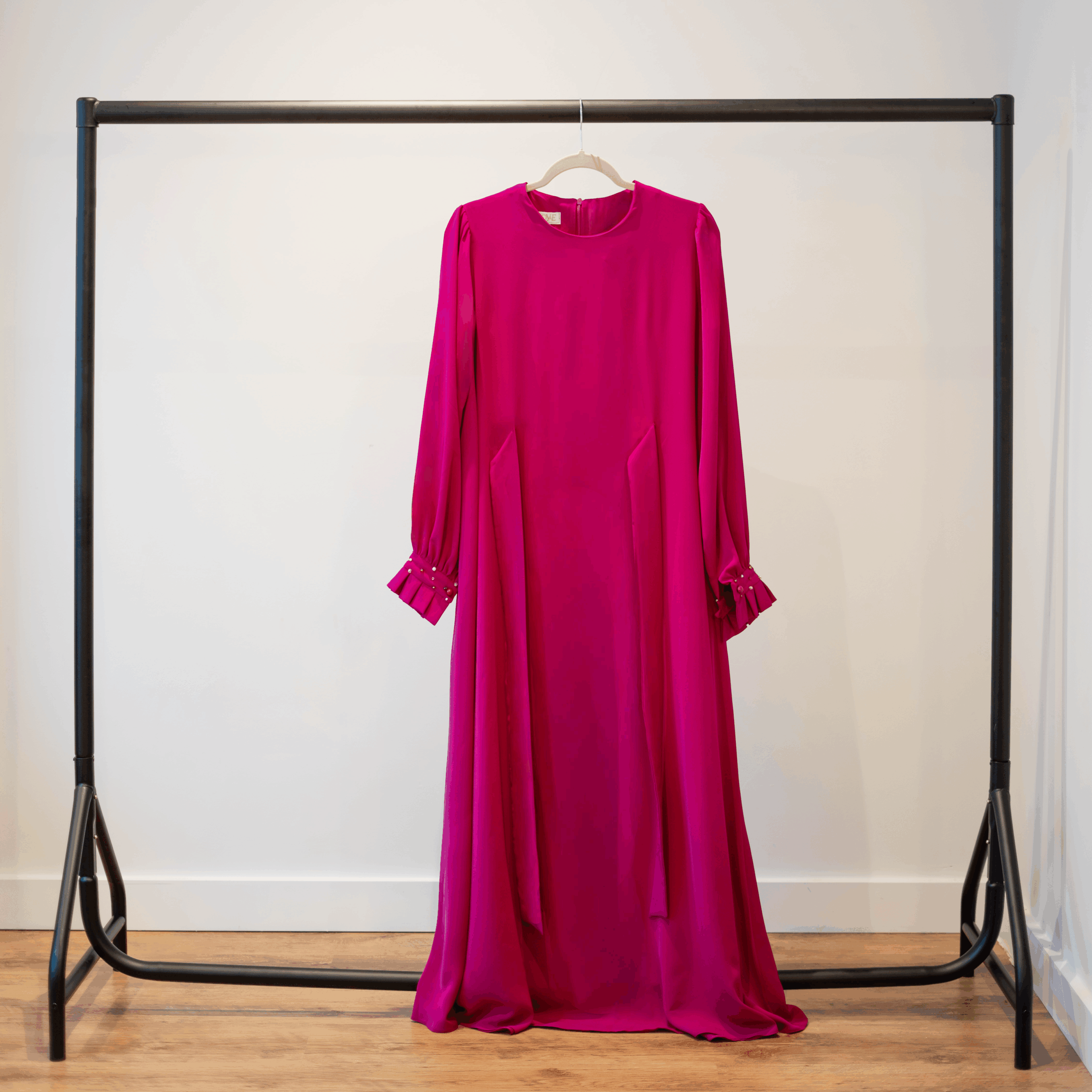 Nova kimono-style long dress in fuchsia — full front view on hanger