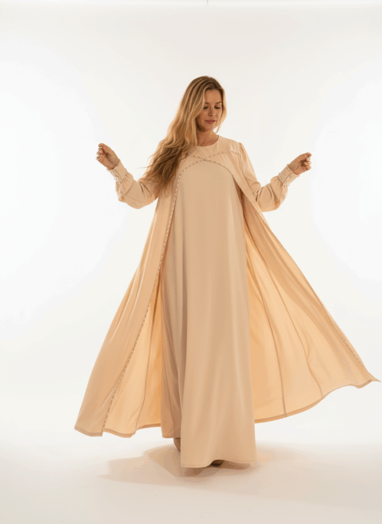 Waterfall beige abaya – full-length view on model, flowing design
