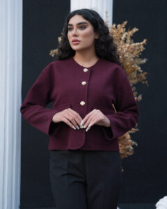 Model wearing ROYAÉ limited edition suede-effect wool jacket with gold-tone buttons