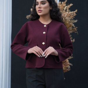 Model wearing ROYAÉ limited edition suede-effect wool jacket with gold-tone buttons