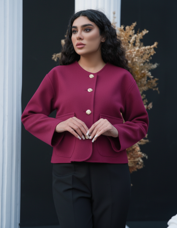 Model wearing ROYAÉ limited edition suede-effect wool jacket in raspberry deep berry colour