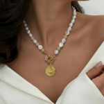 Royaé pearl necklace with gold coin pendant on jewelry display card
