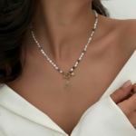 Royaé pearl necklace with gold pendant worn by model